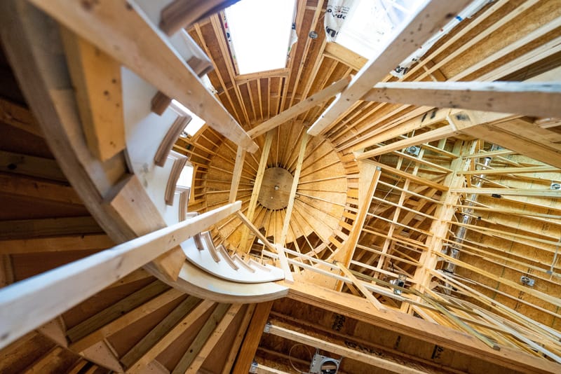 Upward view of wood framing in a home under construction